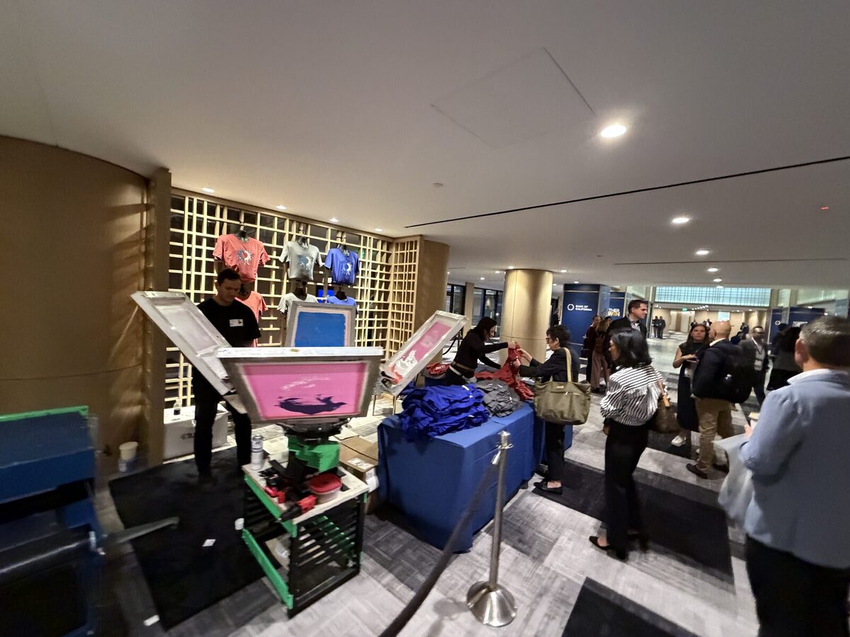 Guests gathered around a live press station at an event