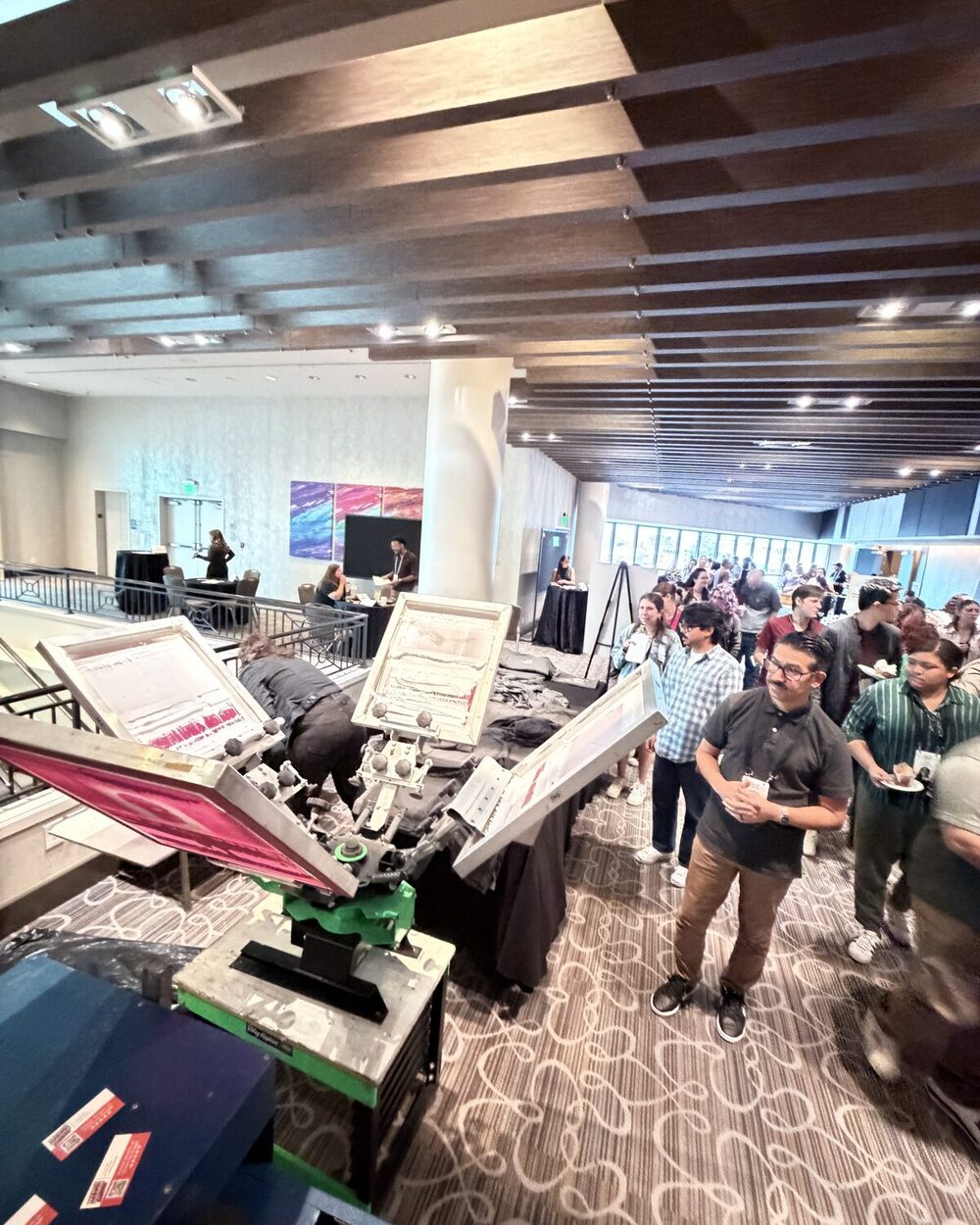Crowd around a live event print station